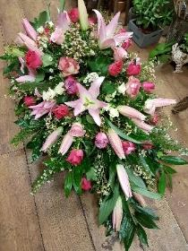 Full casket spray in pink and white